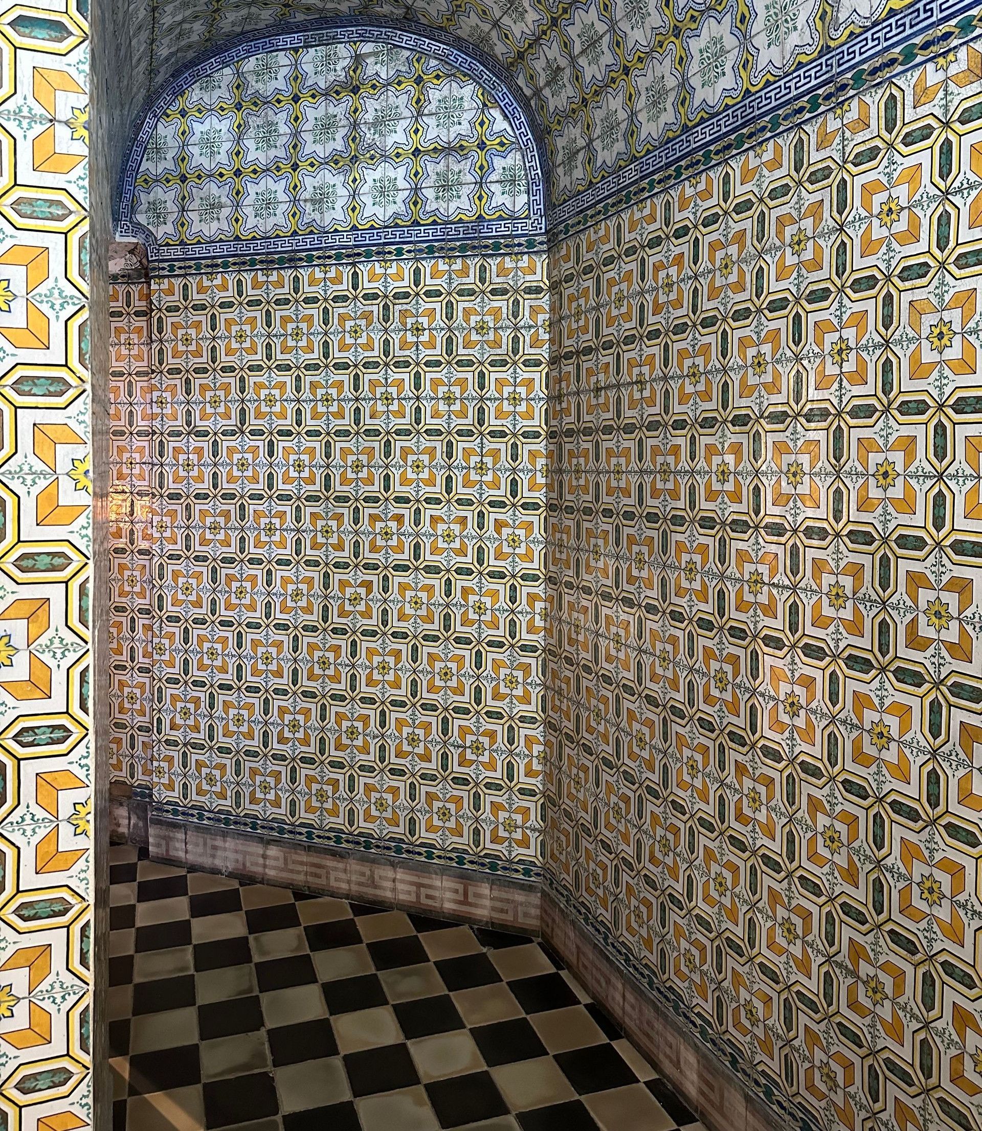 Explore the intricate tile patterns in a corridor showcasing Portuguese architectural design.